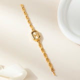Helena® - Elegant Gold Watch Featuring an Oval Dial and Sleek Black Frame