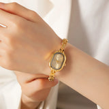 Helena® - Elegant Gold Watch Featuring an Oval Dial and Sleek Black Frame